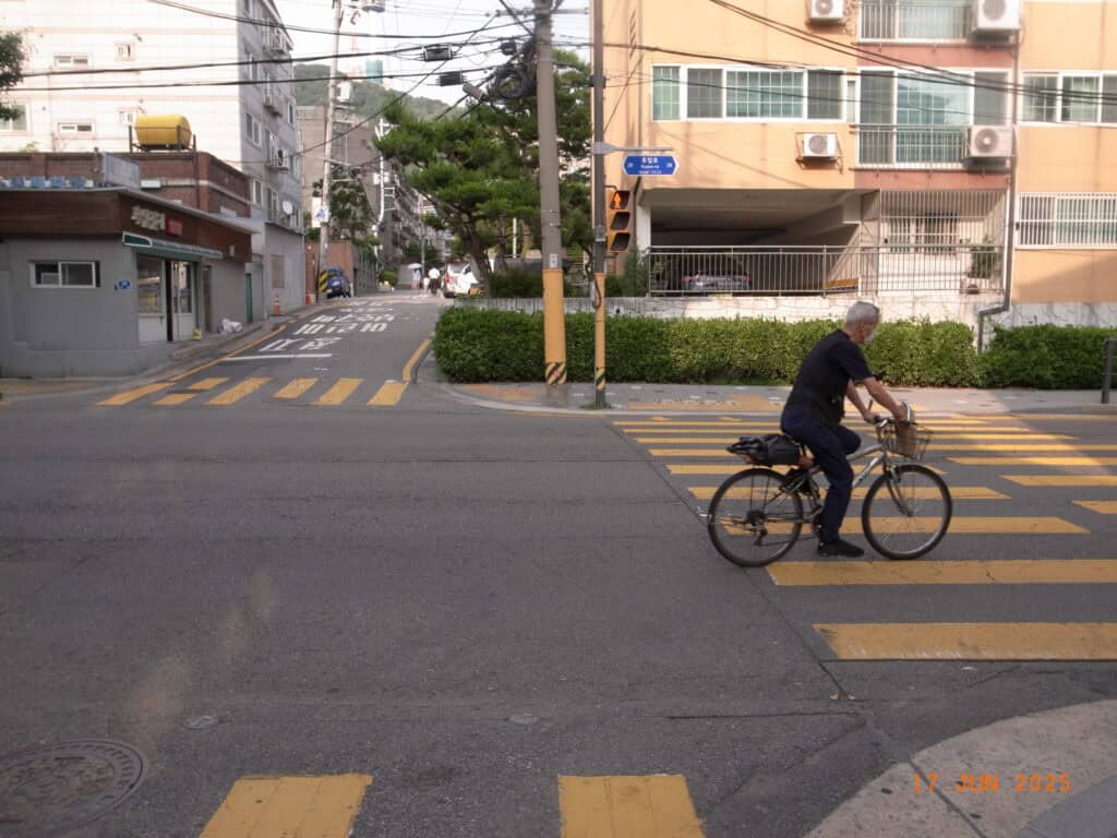 Old man crossing the street in Seoul