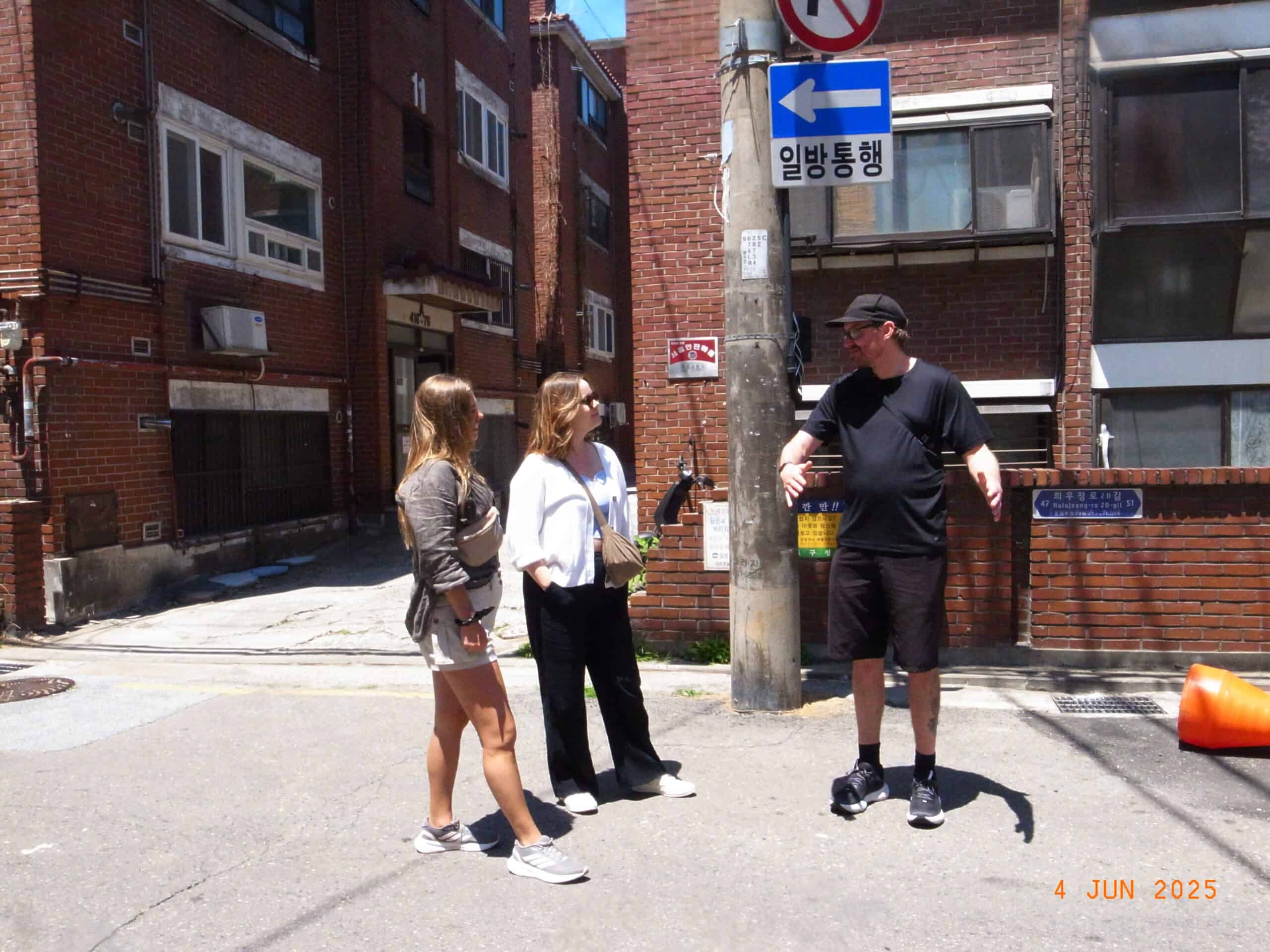 Brush pen writing Korean name on a fan