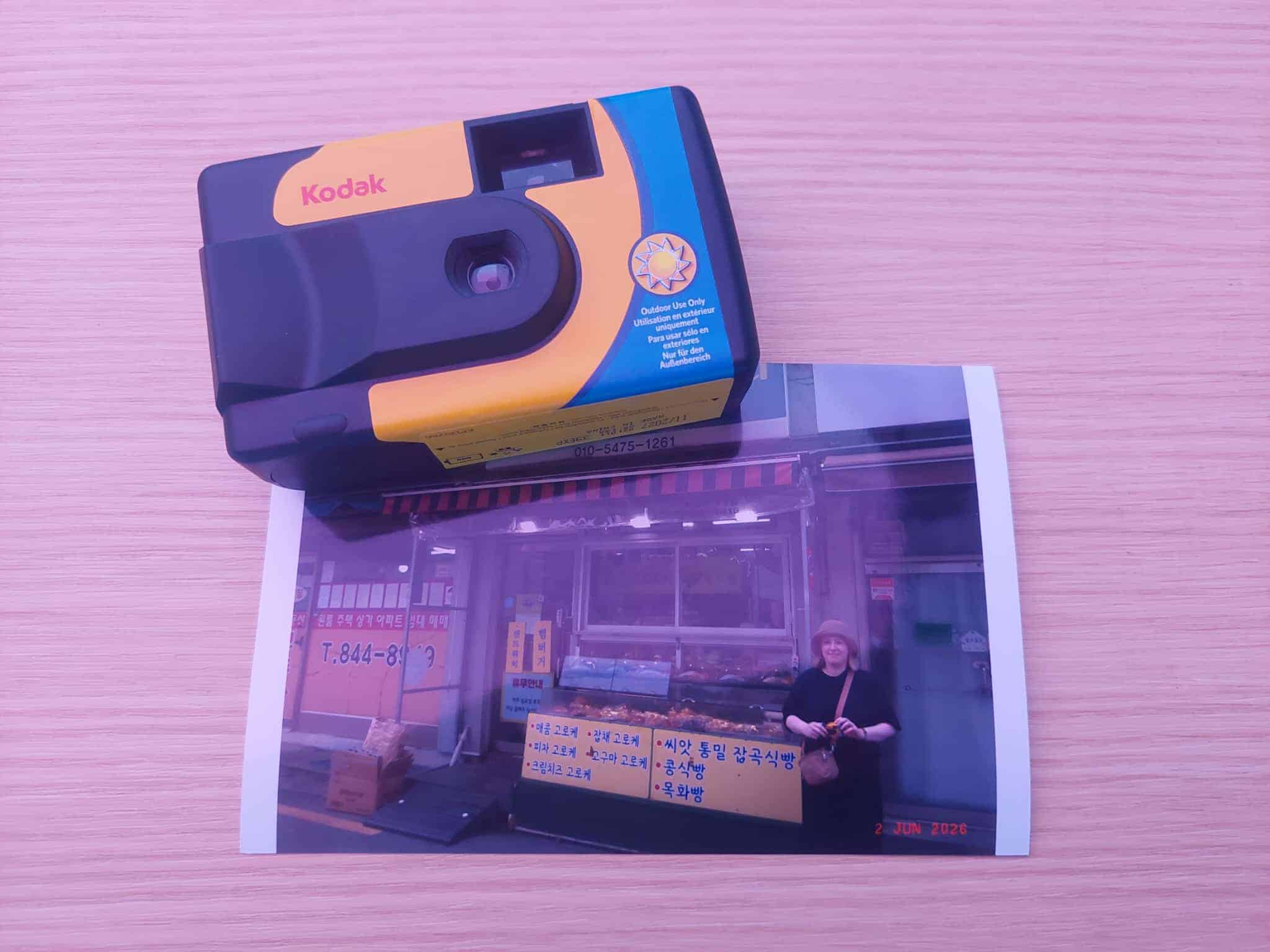 A printed film photo handed to a guest